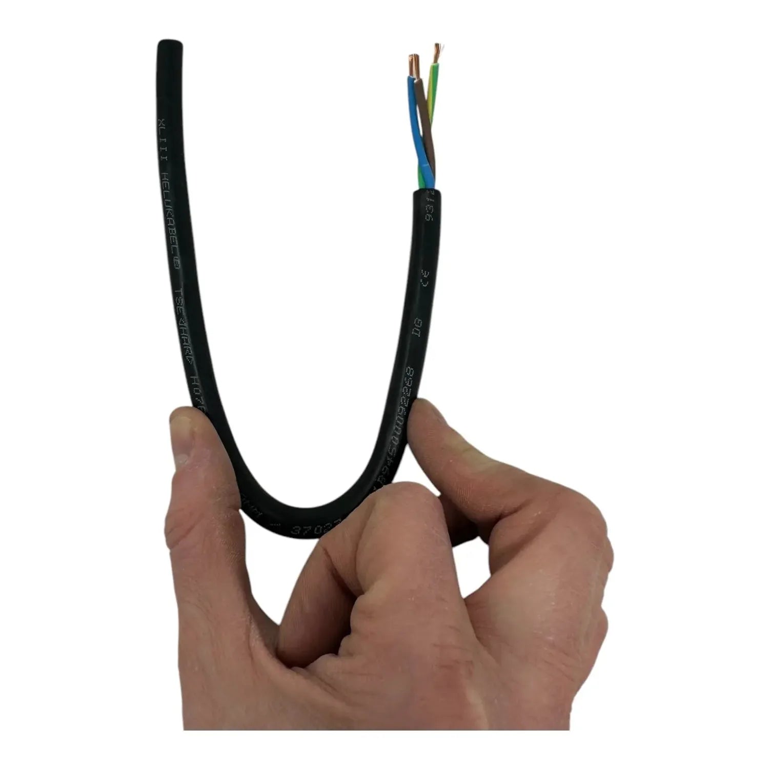 Hand holding flexible black rubber power cable with three exposed copper and colored wire conductors at end.