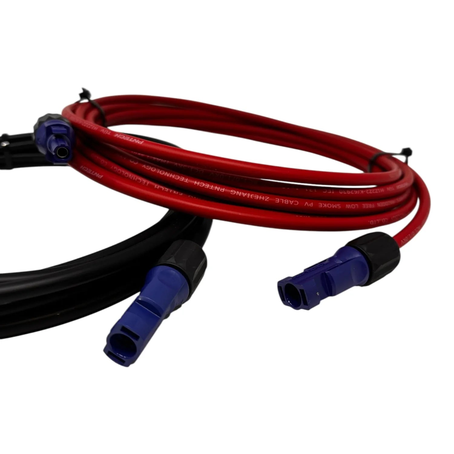 Red and black solar PV extension cables with blue Amphenol connectors coiled together against white background.