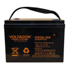 Voltacon HXG6-200 sealed lead battery with black case, orange branding, and black carrying handle.