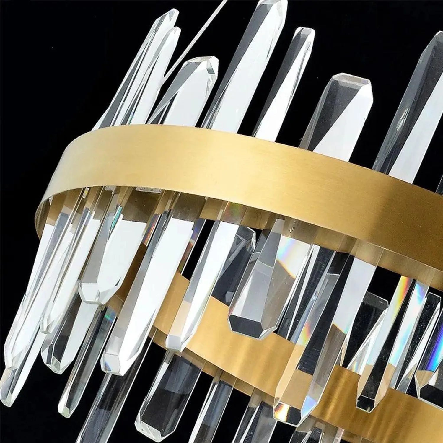 Gold and crystal LED ceiling pendant light with stacked clear crystal rods and brass bands against black background, product 