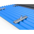 Blue corrugated metal roof with aluminum mounting rails and metal brackets for solar panel installation.