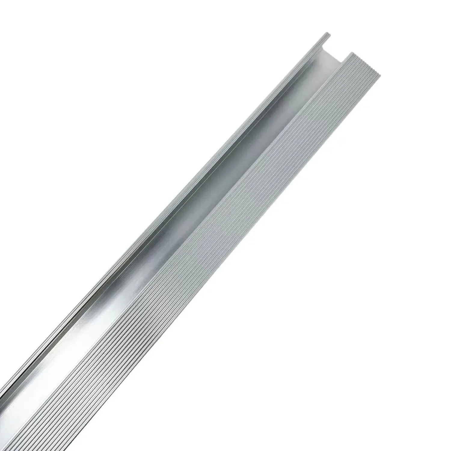 Silver aluminium mounting rail with grooved surface and slot channels, angled against white background.