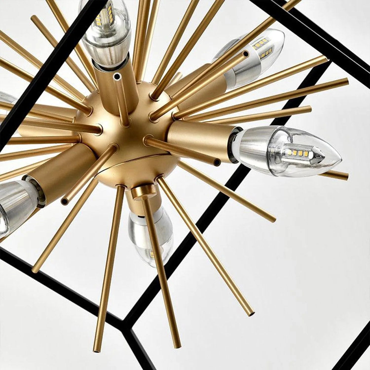 Astral LED ceiling pendant light with six brass arms radiating from central gold sphere, each fitted with clear glass shade a