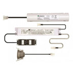 Liteplan LED emergency lighting components displayed flat lay showing battery pack, driver unit, transformer, wiring harness,