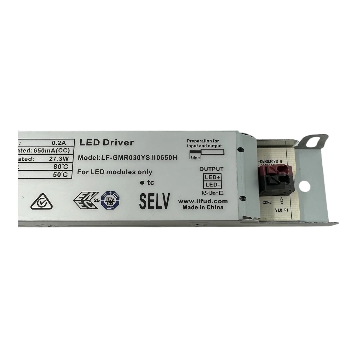LED driver unit showing specifications, output terminals, and certification markings on gray metal housing.