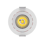 White circular LED downlight with yellow LED module visible through center, tilted mounting brackets on sides, shown against 