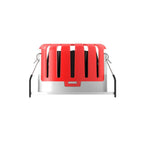 Red and silver dimmable LED downlight with five vertical slot vents and tilting bracket, front view product shot.