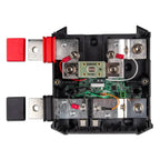 Top-down interior view of Victron Lynx Shunt module showing metal busbars, red and black cable connectors, green circuit boar