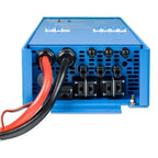 Blue Victron power inverter with red and black cable connectors and multiple terminal blocks on front panel.