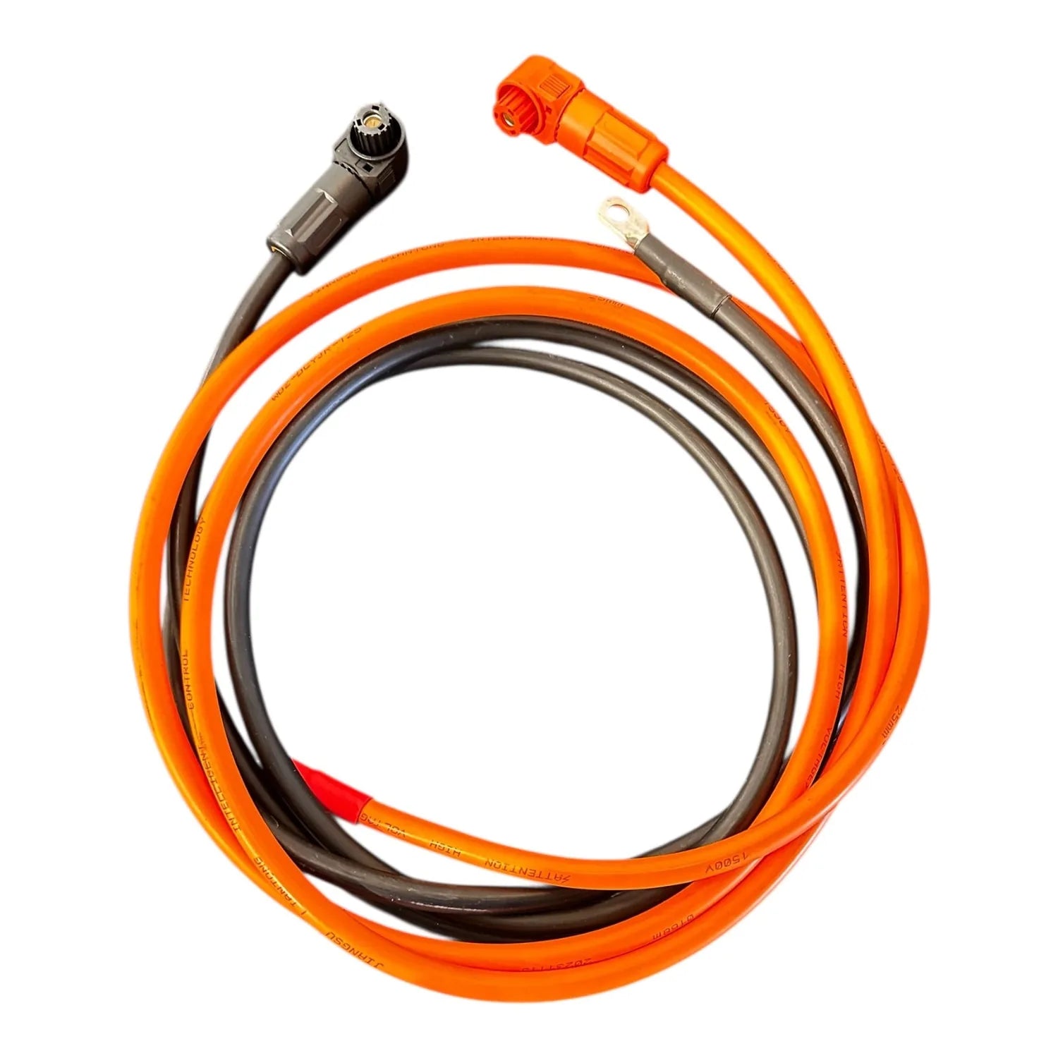Coiled orange and black power cable with connector terminals on white background.