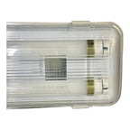 Top view of LED twin tube fitting with clear polycarbonate housing, dual fluorescent tubes, and brass connectors.