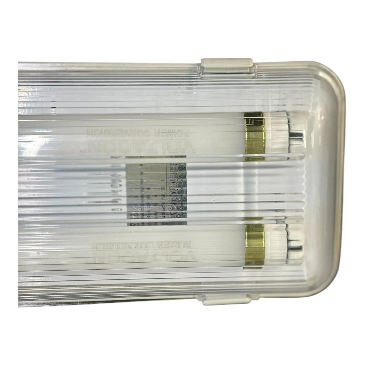 Top view of LED twin tube fitting with clear polycarbonate housing, dual fluorescent tubes, and brass connectors.