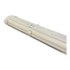 Cream-colored LED tube fitting with two parallel fluorescent tubes, metal clips, and IP65-rated weatherproof housing, shown a