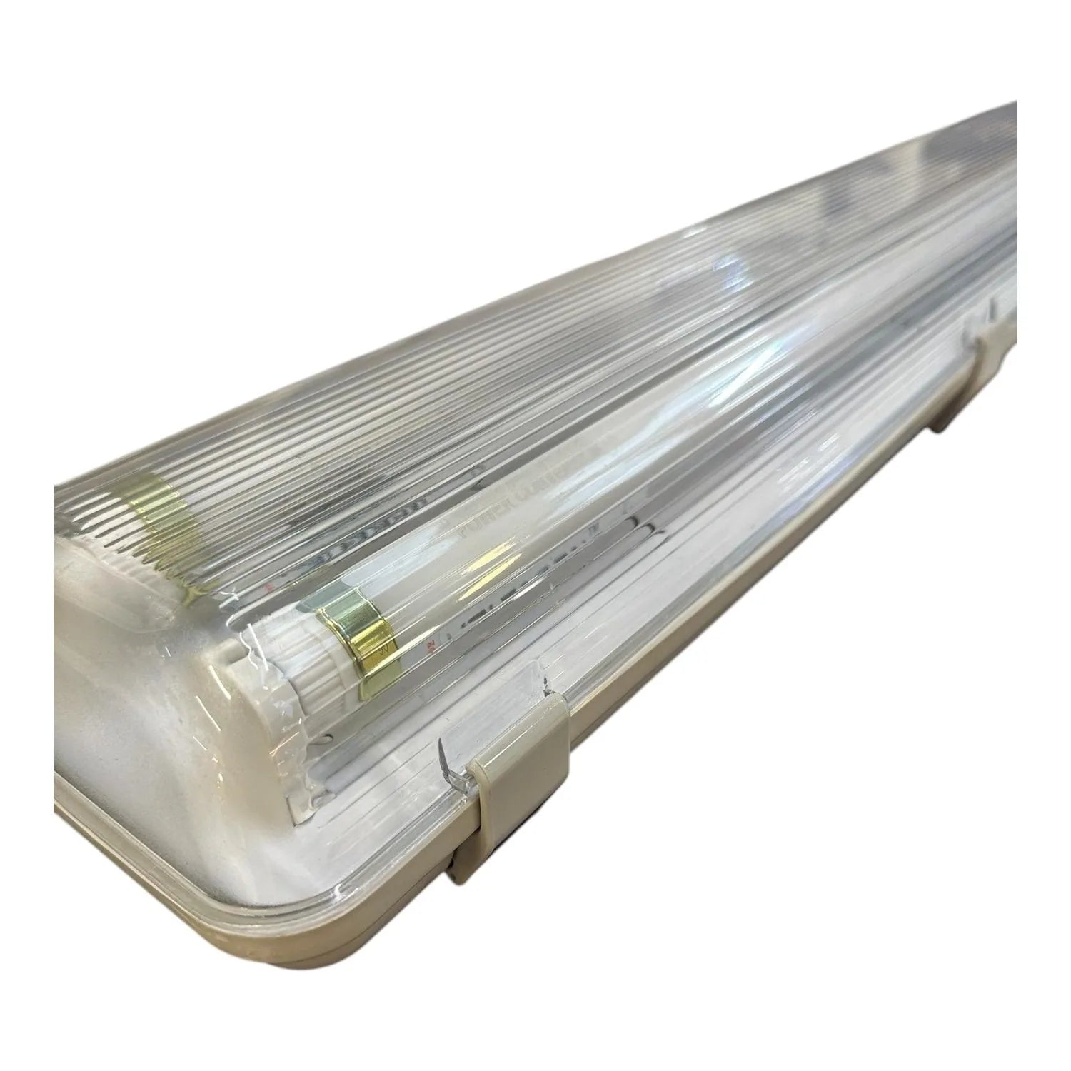 Linear LED tube fitting with clear polycarbonate cover and white housing, featuring two fluorescent tubes with brass connecto