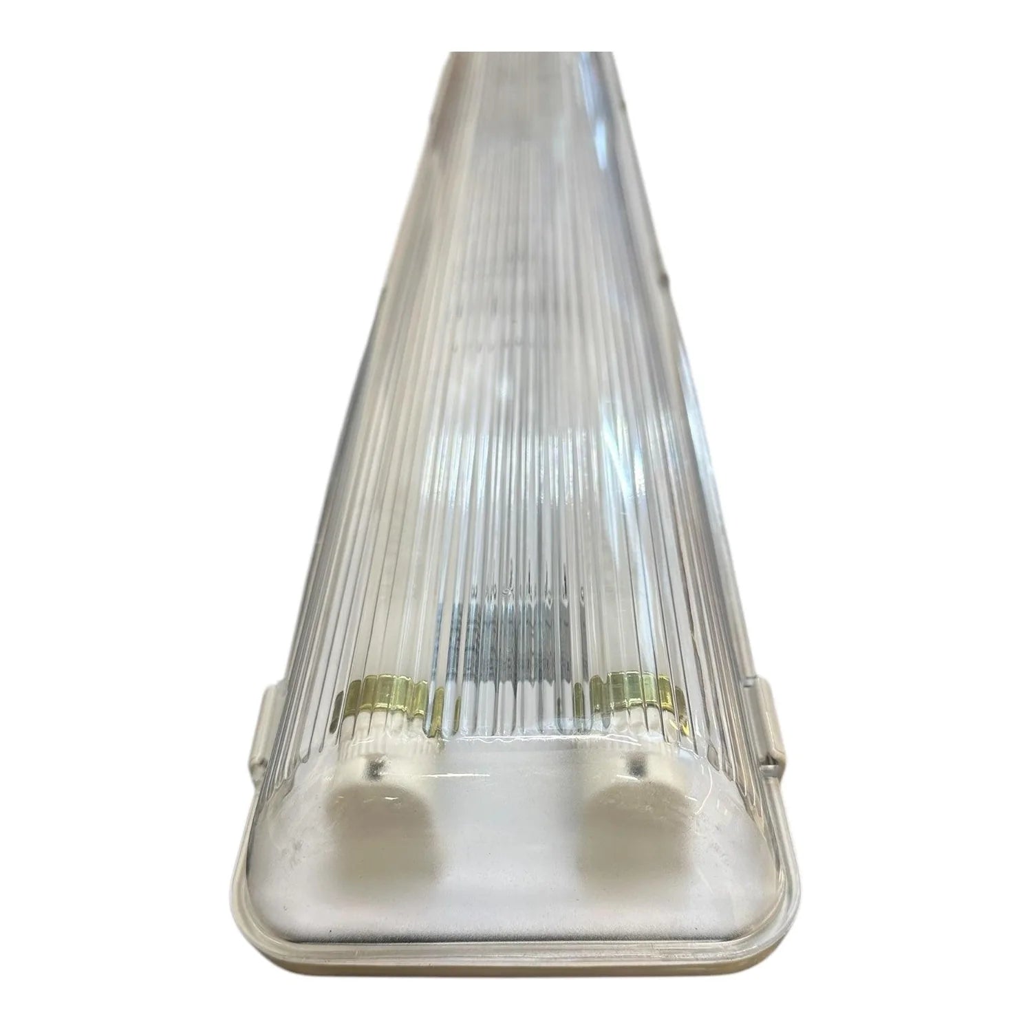 LED twin tube fitting with clear ribbed polycarbonate cover, white base, and brass connectors, shown against white background