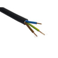 Close-up of three-core electrical cable with black outer sheath and blue, brown, and green-yellow copper conductors exposed a