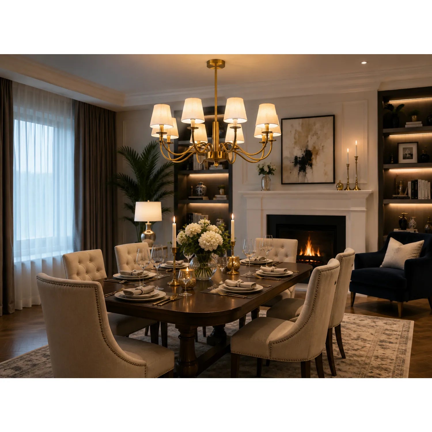 Aurelia gold eight-light chandelier installed in elegant dining room above dark table with cream upholstered chairs and firep