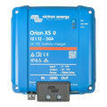 Victron Energy Orion XS 12/12-50A DC/DC battery charger with remote control panel, blue housing with specification labels and