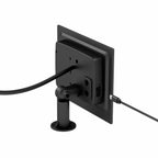 Black security camera mounted on wall with adjustable bracket and power cable, installation shot.