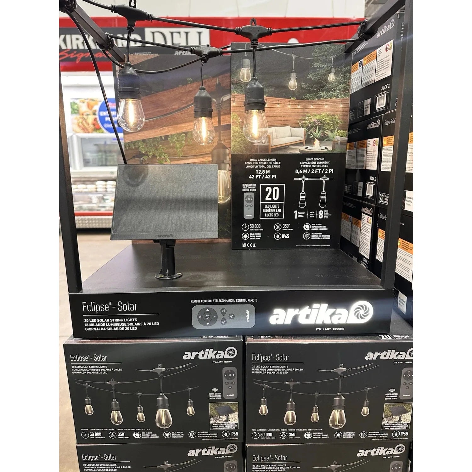 Artika Eclipse Solar string lights display with product boxes stacked below, showing remote control and 20 LED specifications