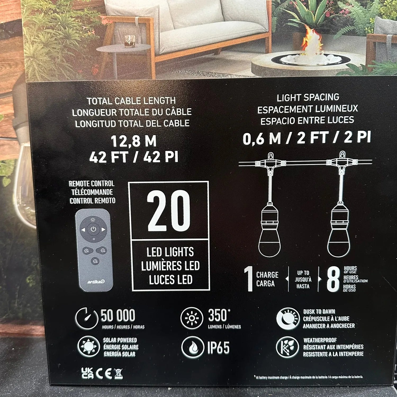 Back of Artika Eclipse Solar String Lights packaging showing specifications: 20 LED lights, 12.8m cable, 0.6m spacing, remote