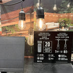 Solar string lights packaging with product specifications, remote control, and installation photos showing warm LED bulbs str