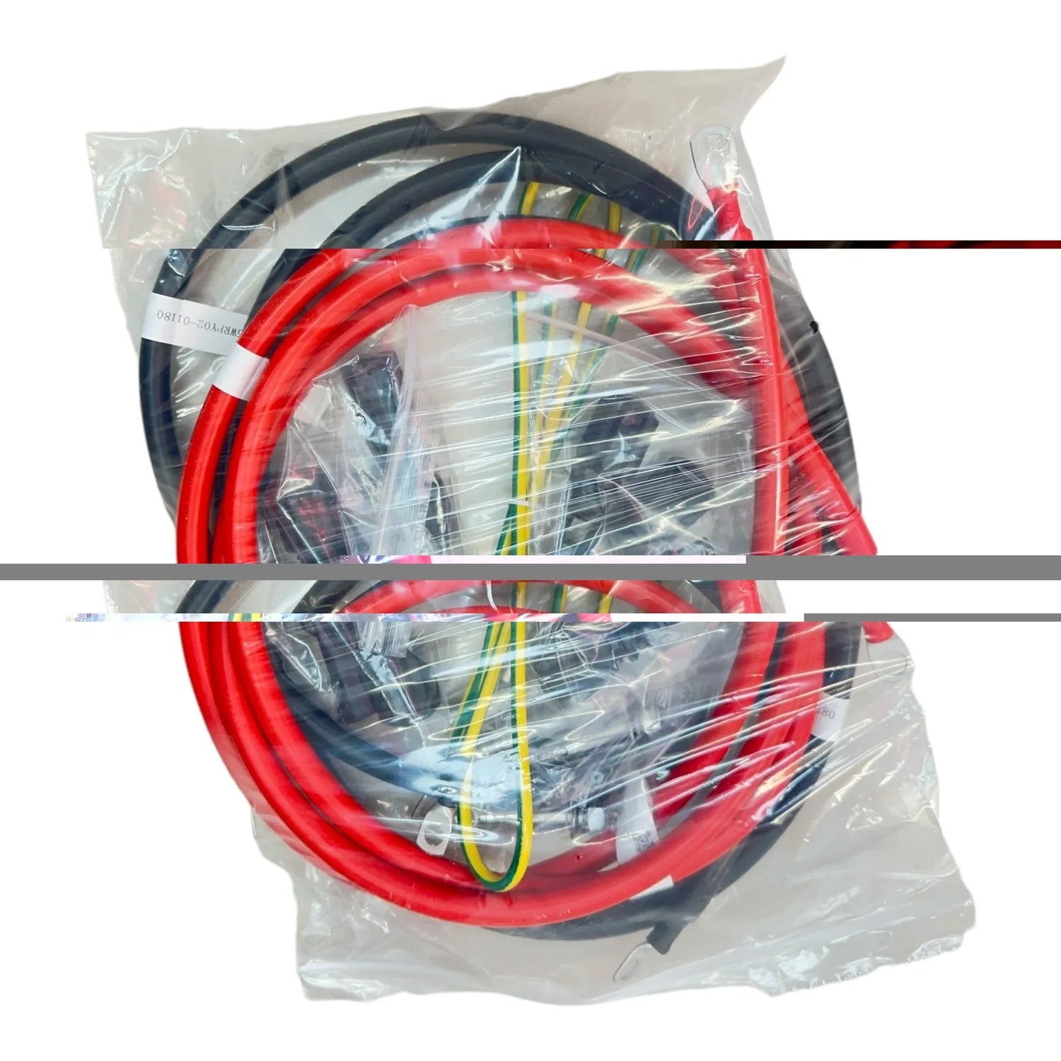 DC Combiner Box 100A IP55 with red and black cables coiled in plastic packaging, showing internal wiring and connectors.
