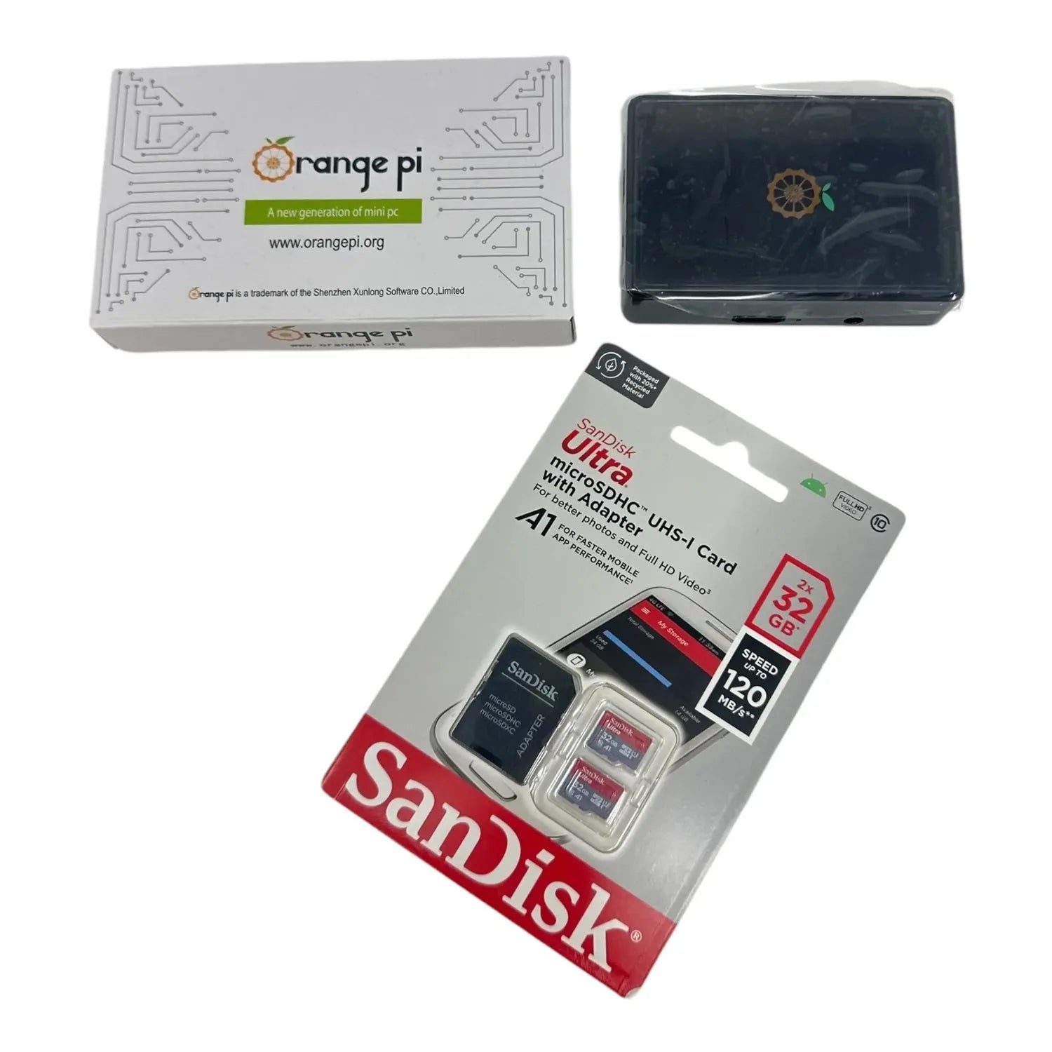 Orange Pi mini PC with black case, white retail box, and SanDisk 32GB Ultra microSD card with adapter packaging displayed tog