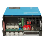 Victron MultiPlus-II inverter charger interior showing circuit board, terminal connections, red battery posts, and cooling ve
