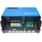 Interior view of blue and black inverter showing circuit boards, terminal connectors, and ventilation ports on underside.