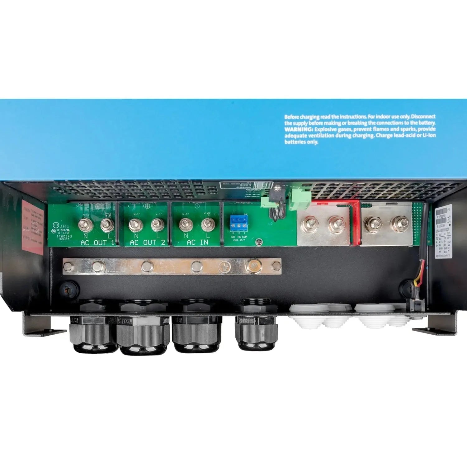 Internal view of Victron MultiPlus-II inverter charger showing circuit boards, connectors, and capacitors with warning label.