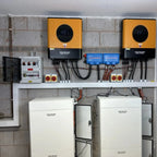Voltacon off-grid solar installation with two yellow inverters, blue battery management units, white lithium battery storage 