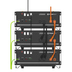 Stacked rack system showing three US5000 battery units with orange cables and green power cords connected vertically.