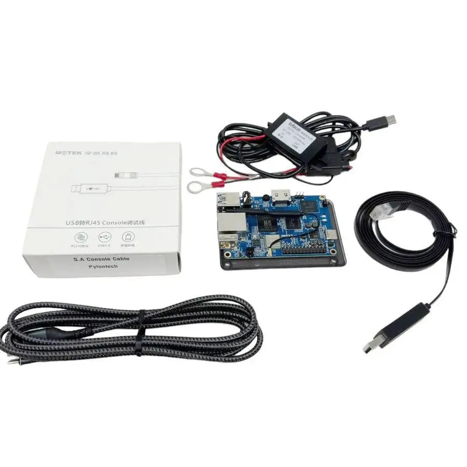 USB to RJ45 console cable kit with circuit board, power adapter, and cables displayed with original packaging.