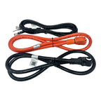 Three coiled electrical cables displayed: black power cord at top, red and black battery extension cables with connectors bel