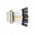 Attica LED linear trunking feed-in connector with beige housing, multiple white rails, black end caps, and yellow measurement