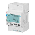 Carlo Gavazzi three-phase energy meter with LCD display showing power consumption and total kilowatt hours, mounted on DIN ra