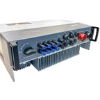 Solis hybrid inverter with gray casing, DC switch, multiple blue terminal connectors, red AC output socket, and heat sink fin