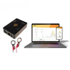 Solar Assistant monitoring device with CT clamps displayed alongside laptop and smartphone showing energy dashboard analytics
