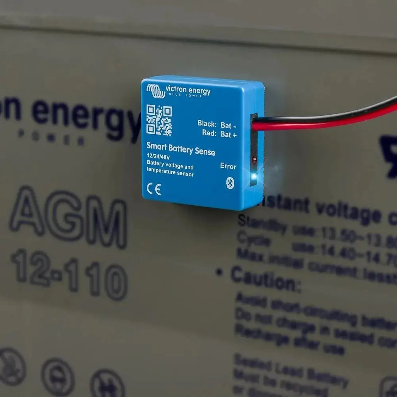 Victron Energy Smart Battery Sense blue wireless sensor with black and red battery terminals and Bluetooth indicator, display