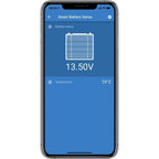Smartphone displaying Smart Battery Sense app showing battery status of 13.50V and temperature of 29°C with battery icon grap