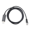 Black USB to RJ45 interface cable coiled on white background, product shot.