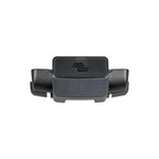 Black plastic cable management box with coiled wire ports on sides and embossed logo on top, product view against white backg