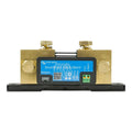 Victron SmartShunt 1000A battery monitor with brass terminals and blue display panel mounted on black base.