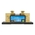 Victron SmartShunt 200A/50mV battery monitor with brass terminals, blue digital display, and green terminal block, mounted on