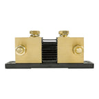 Brass and black metal battery monitor shunt with two large circular connection points and adjustment bolts mounted on black b