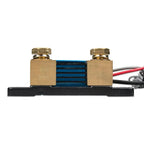 Brass shunt with blue resistor element mounted on black base, connected to red, black, and gray wires.