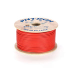 Red solar PV cable wound on wooden spool with printed label showing specifications and length markings.