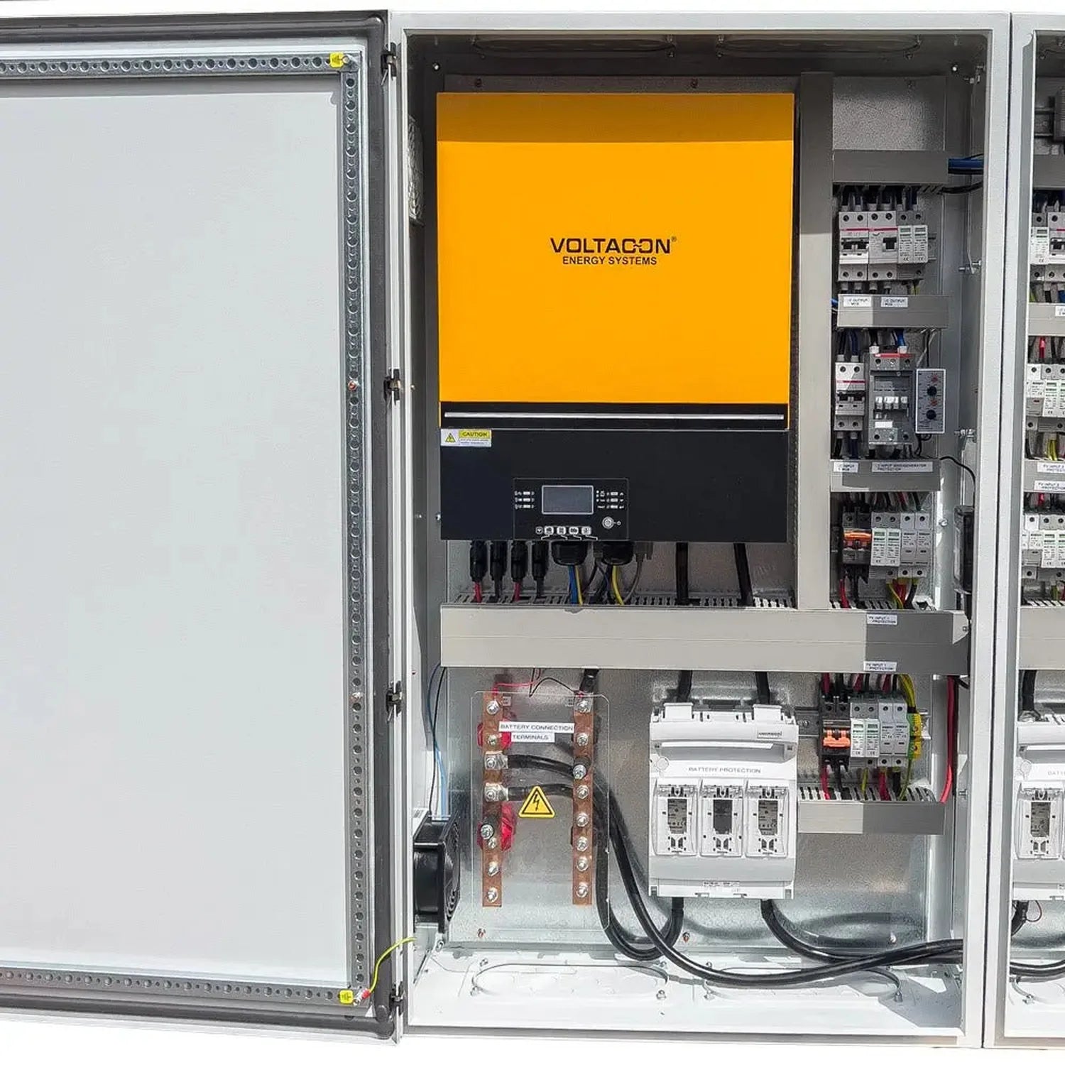 Voltagon Energy Systems 16kW off-grid solar control cabinet mounted in industrial enclosure with yellow front panel, control 