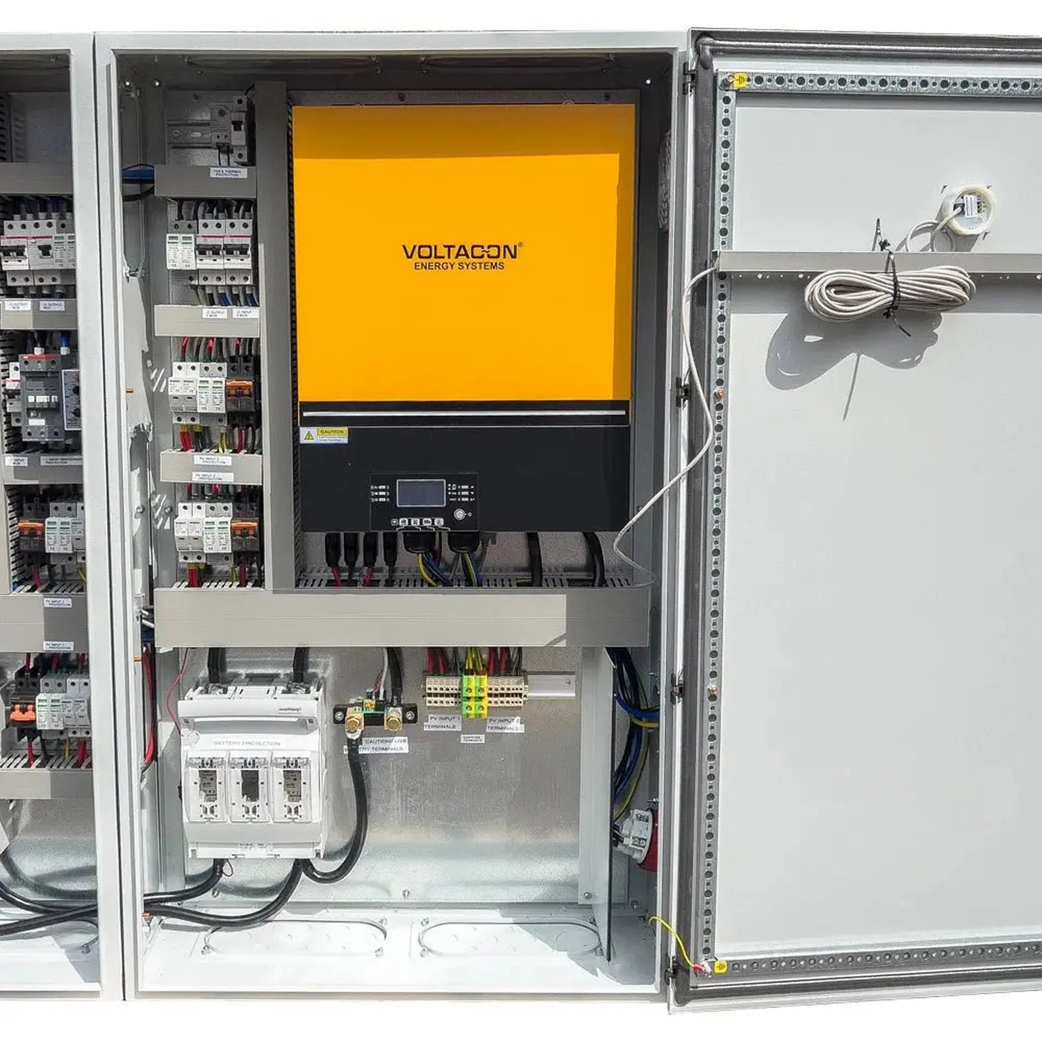 Voltacon Energy Systems 16kW off-grid solar control cabinet mounted in metal enclosure with yellow inverter panel, circuit br